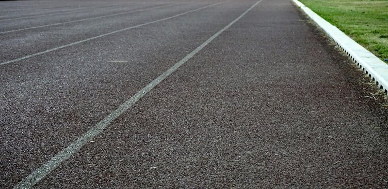 Seal-coated asphalt.