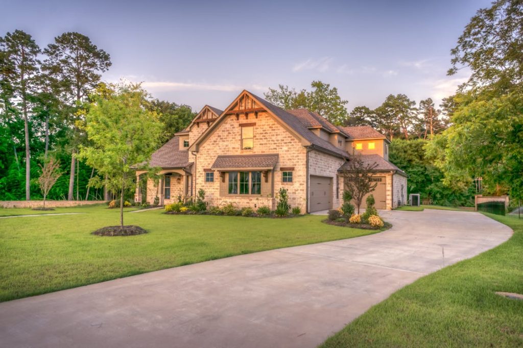 a house with a concrete driveway.