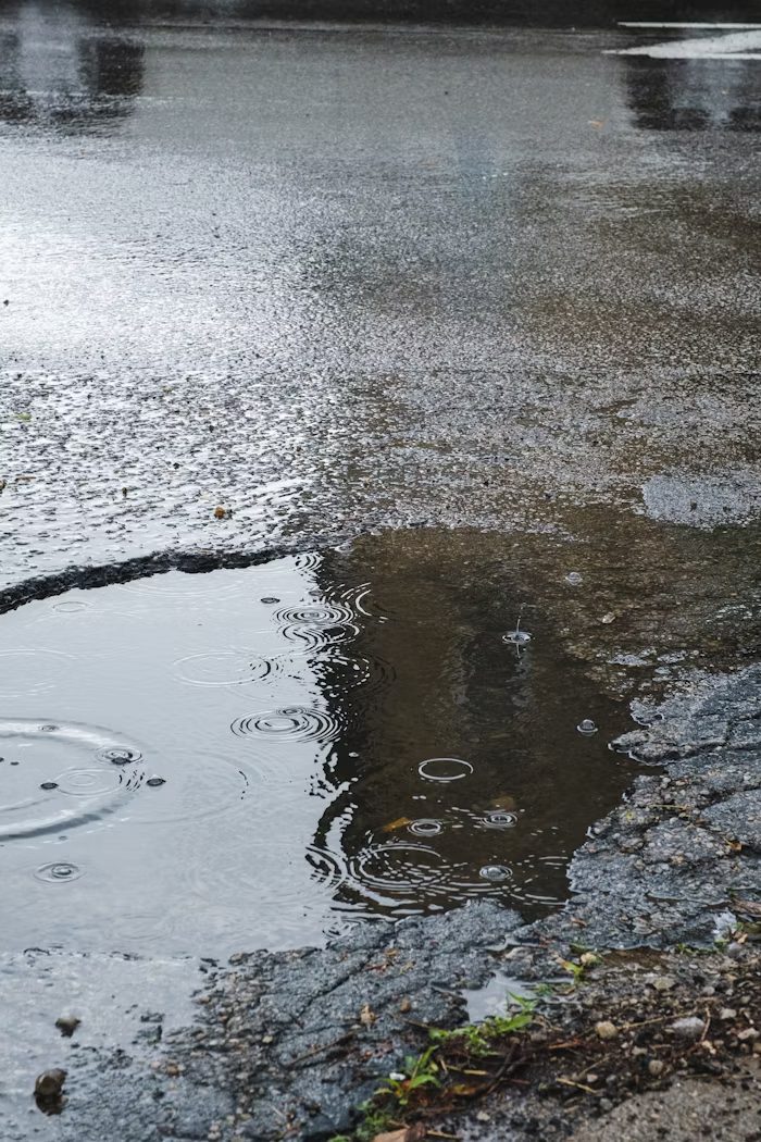 A pothole in the rain.