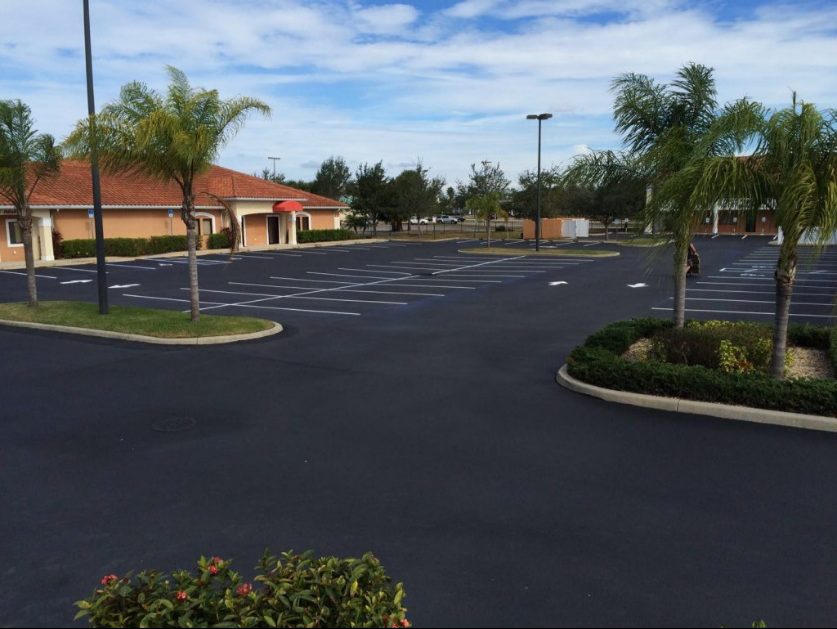 Parking lot with fresh striping and clear markings, cars neatly parked
