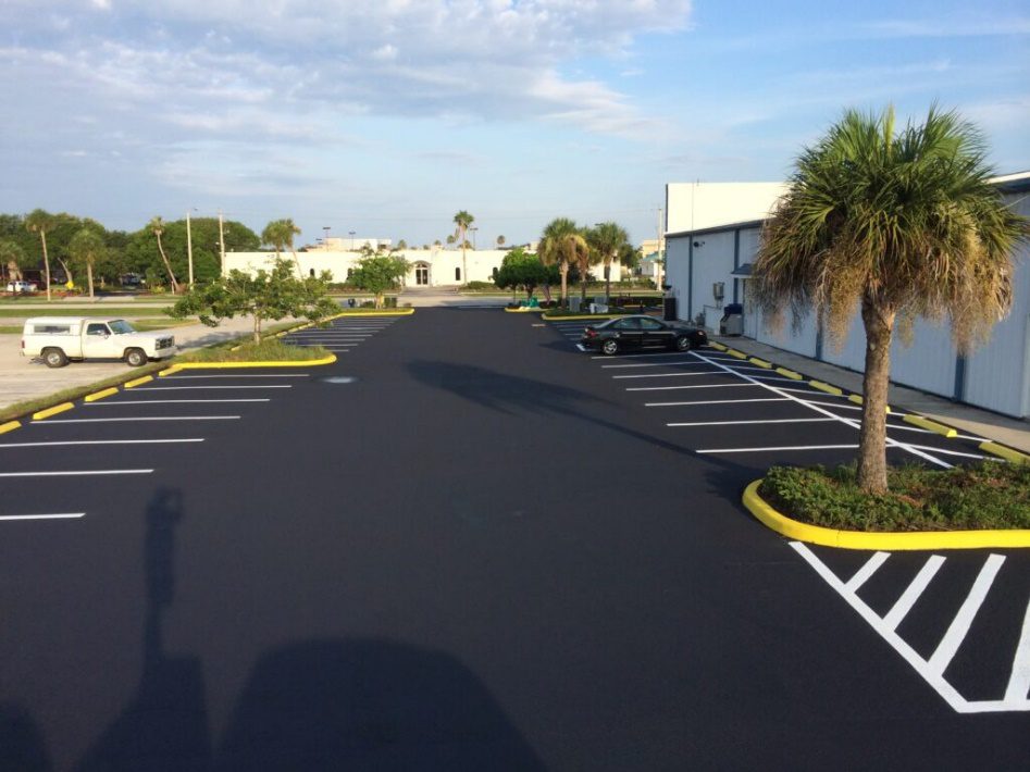 A sealcoated parking lot with new lines protecting the paved surface in North Port
