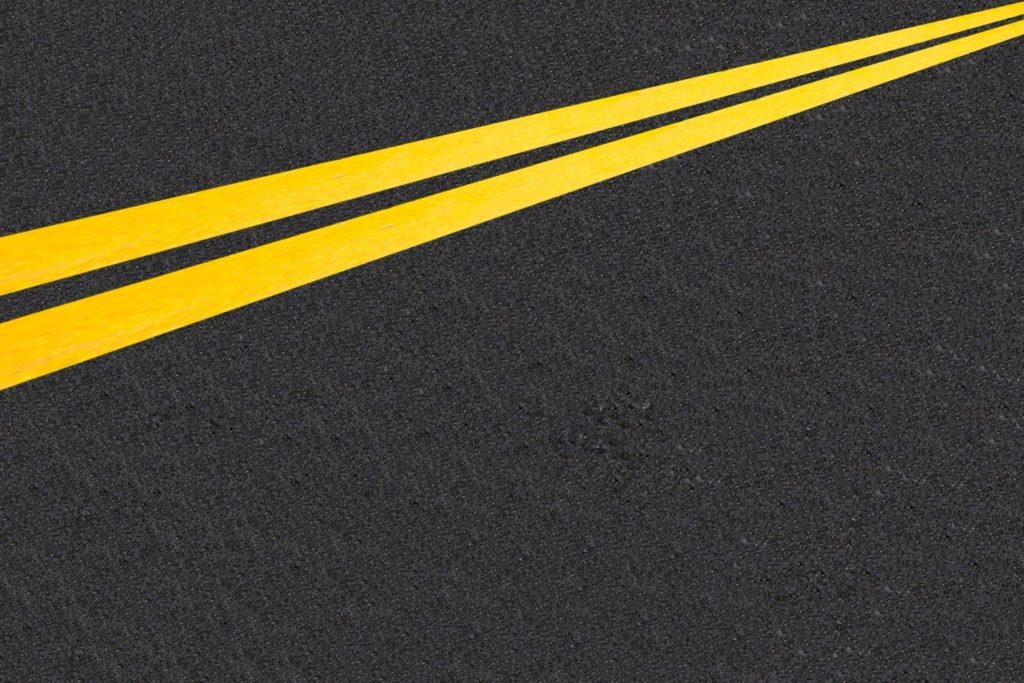 Thermoplastic striping on a roadway