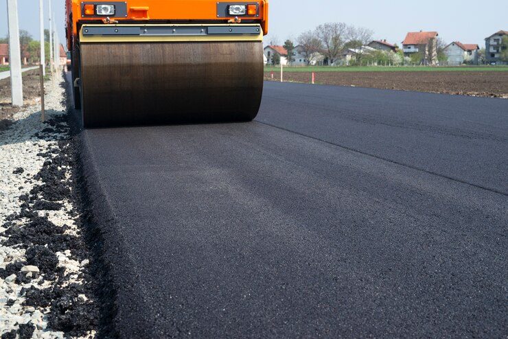 A road roller compacting asphalt