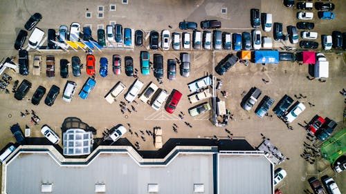 Parking lot with heavy traffic showing wear from poor striping