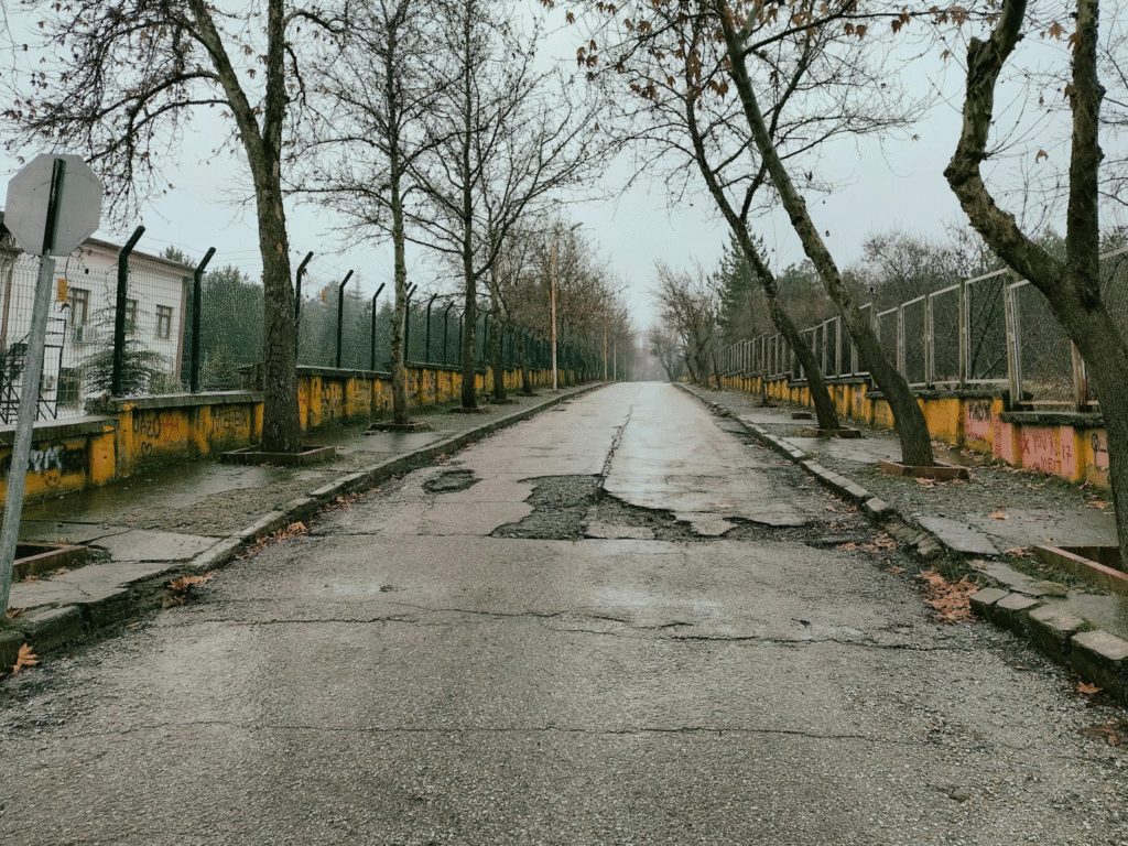 A road with damaged asphalt.