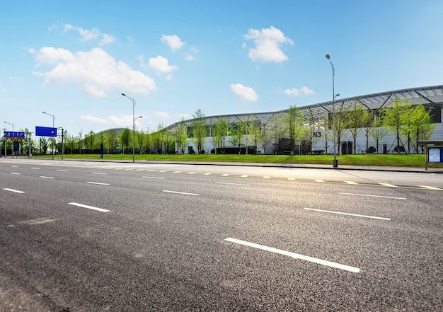 A smooth asphalt road outside a facility, providing safe and durable access for vehicles.