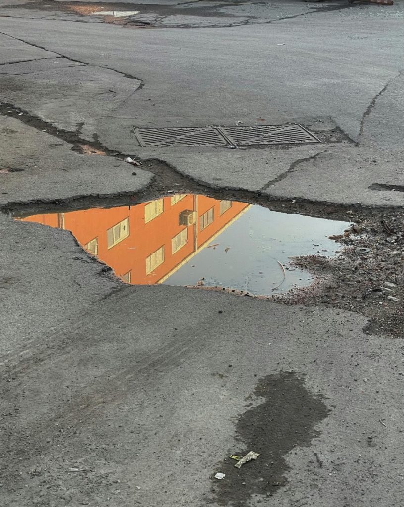 A pothole with water.