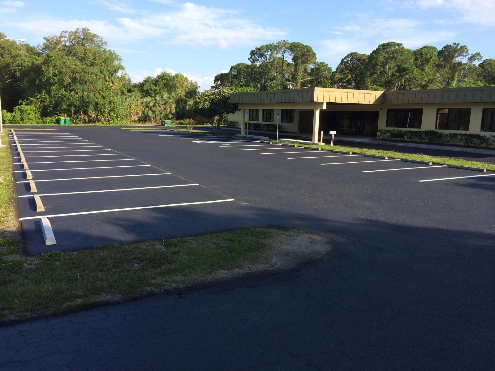 Long sealed and striped lot in front of an office