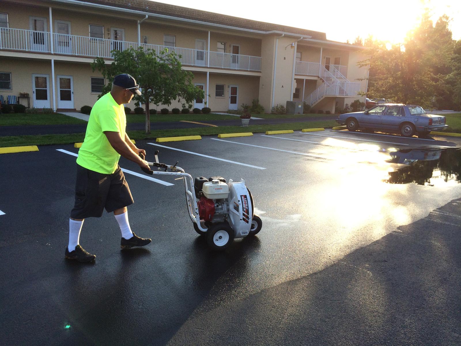 Crew member clearing the surface at sunrise